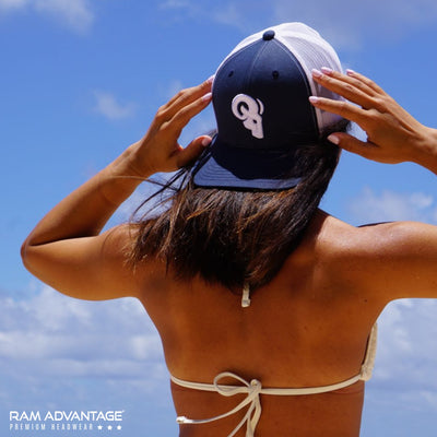 SEXY HAWAIIAN GIRL wearing RAM ADVANTAGE premium ROYAL BLUE and WHITE 3D embroidered TRUCKER HAT in a BIKINI on the BEACH