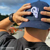 JEREMY SAGE wearing a RAM ADVANTAGE premium NAVY and WHITE 3D embroidered TRUCKER HAT