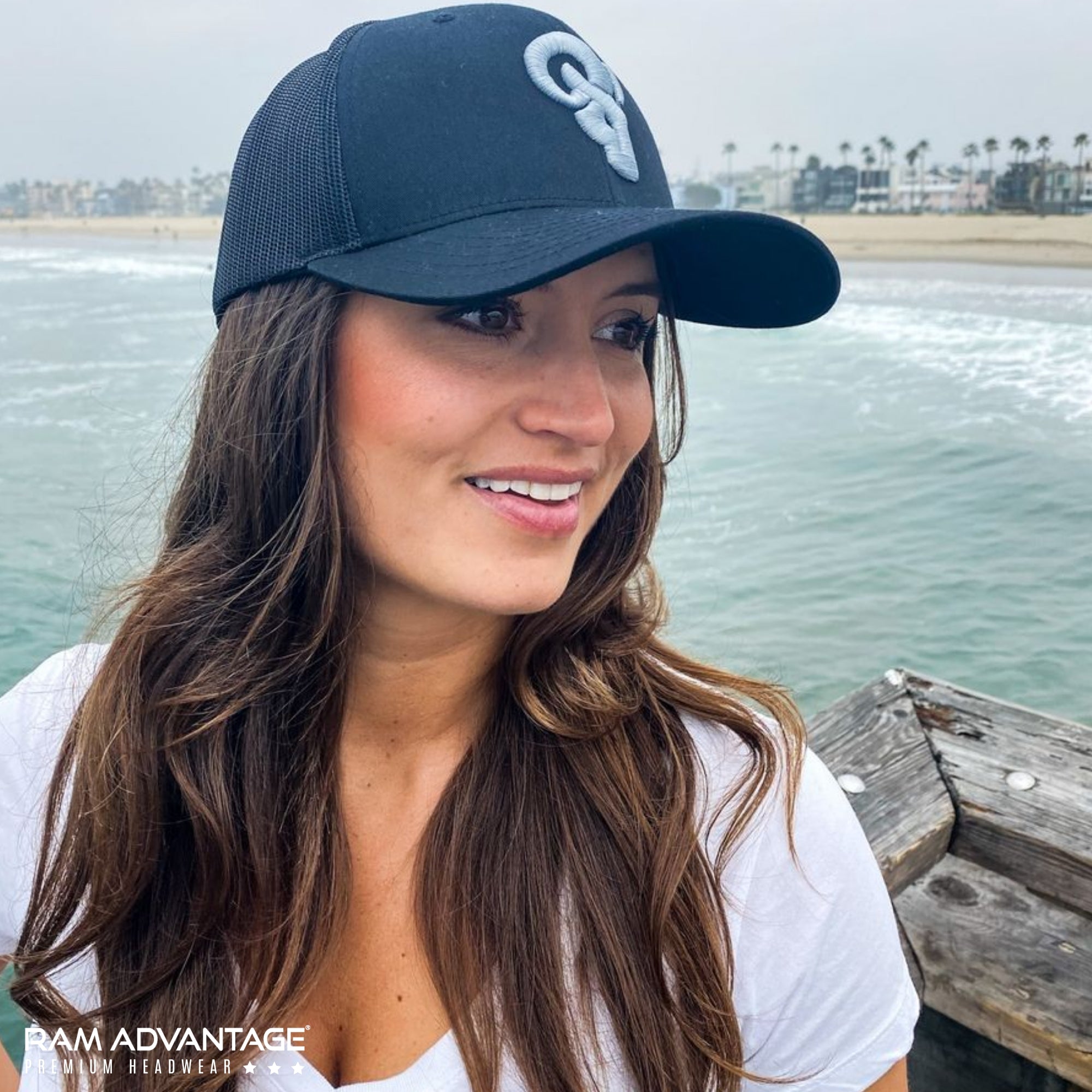 SEXY Model wearing a RAM ADVANTAGE rugged TRUCKER HAT on the SANTA MONICA BEACH designed in USA